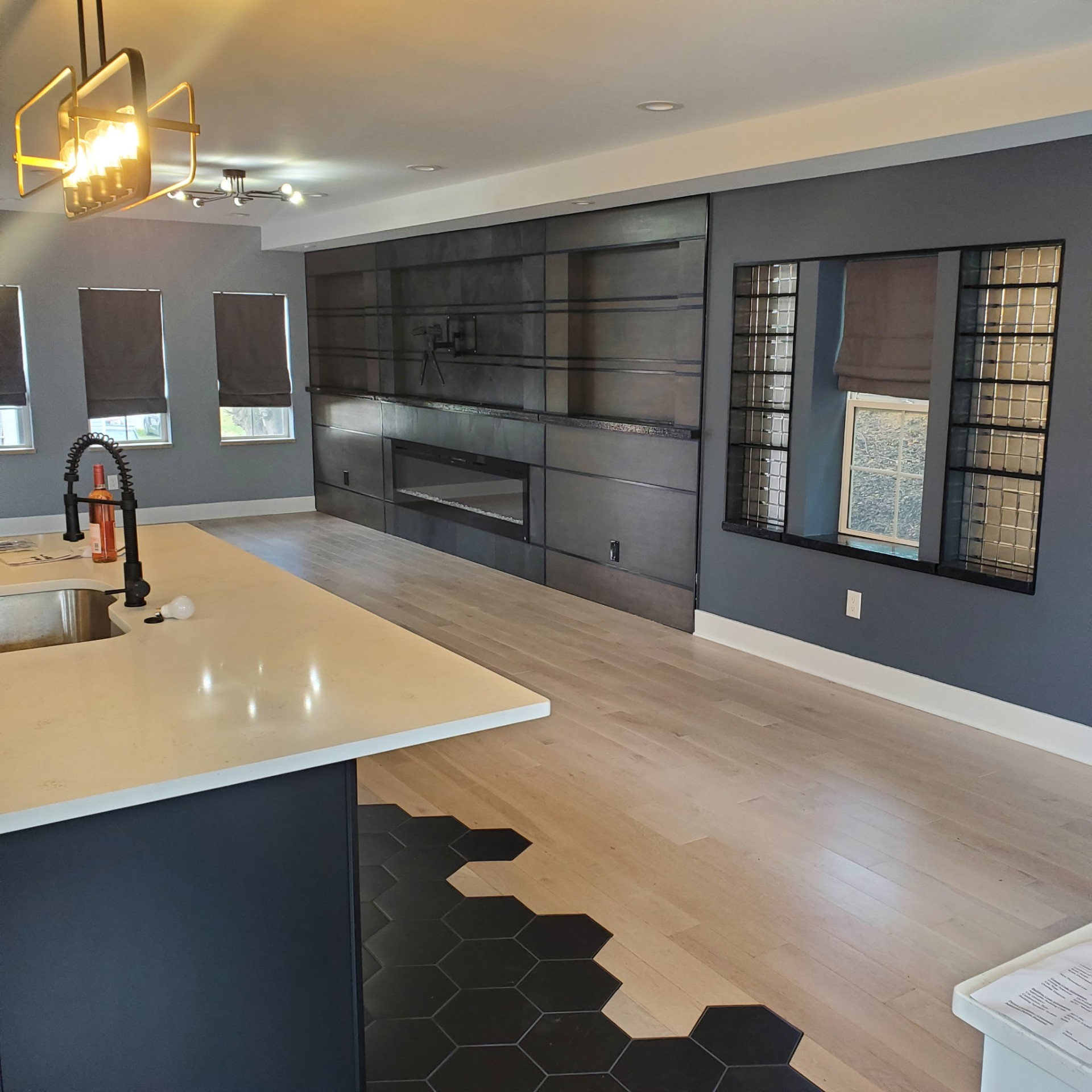 Steel-Clad Fireplace Wall — Full Home Renovation remodel in Sewickley, PA by Trademark Design